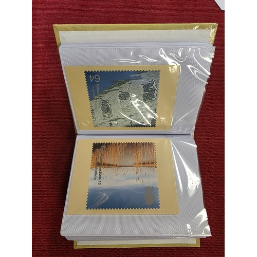 489 - A album collection of Millennium related first day covers together with millennium related postcards... 