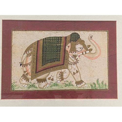 493 - Two pairs of framed and glazed prints on material depicting Asian elephants and Thai dancers.
