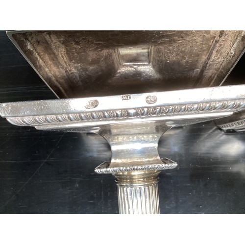 117 - A set of four solid Irish silver column candlesticks on square fluted bases, hallmarked JW, 30 cm H,... 