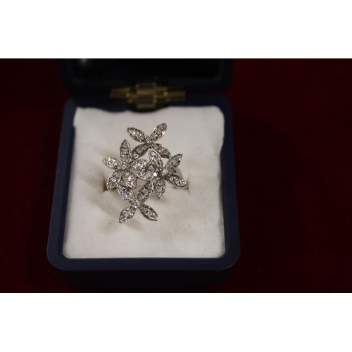 378 - 9CT WHITE GOLD DIAMOND FLOWER RING