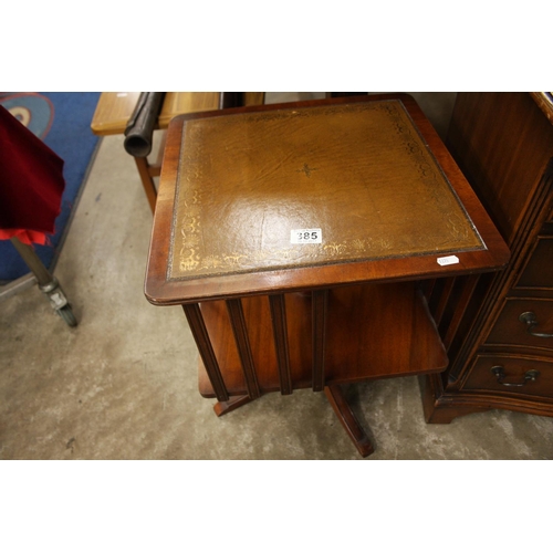 385 - LEATHER TOPPED REVOLVING BOOKCASE