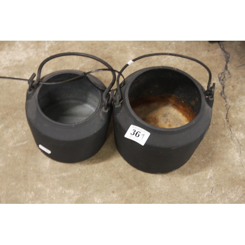 361 - PAIR OF BLACK CAST POTS