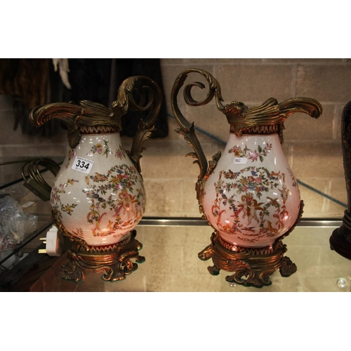 334 - PAIR OF GILT & CERAMIC JUGS