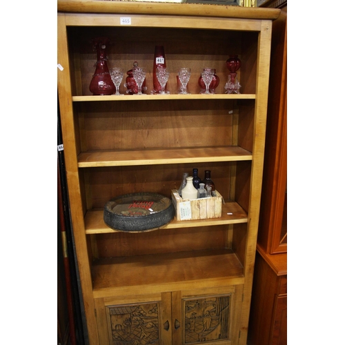 465 - PINE BOOKCASE OVER CARVED CUPBOARDS