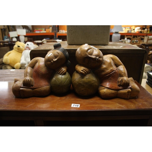 711 - PAIR OF CARVED FIGURES