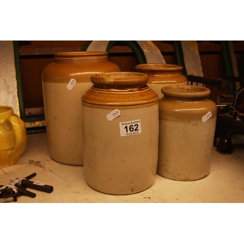 162 - STONE JARS X 4