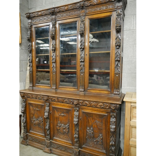 440 - CARVED OAK 3 DOOR BOOKCASE