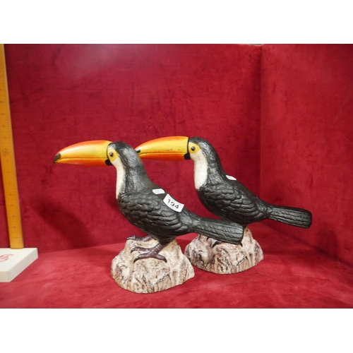 194 - PAIR OF CAST TOUCANS