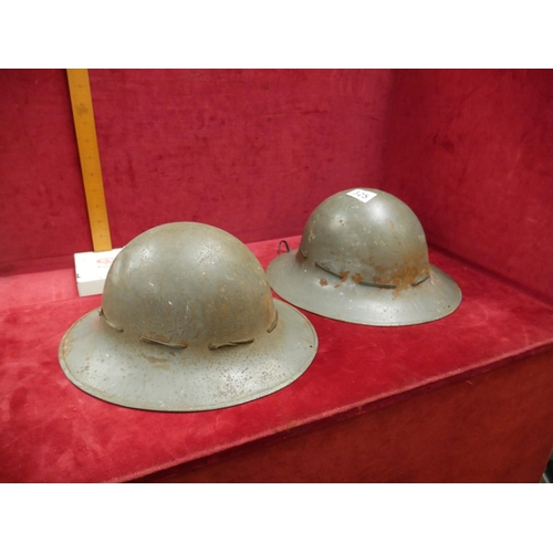 325 - 2 BRITISH ARMY HELMETS