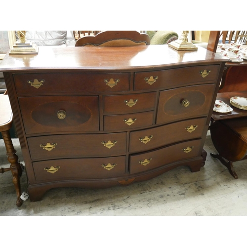 560 - BOW FRONTED CHEST OF DRAWERS