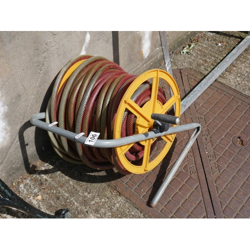 106 - GARDEN HOSE & REEL