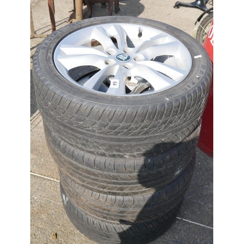 64 - 4 ALLOY WHEELS