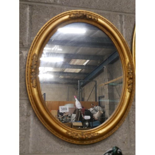 389 - GILT OVAL MIRROR