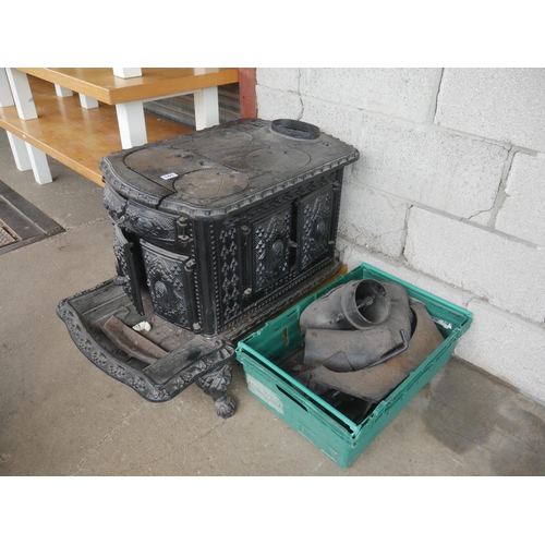 161 - ANTIQUE CAST IRON STOVE (NEEDS REPAIR - PARTS IN CRATE)