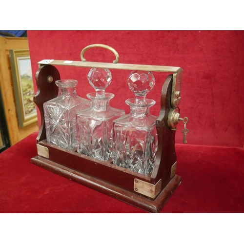 350 - TANTALUS WITH KEY - DECANTERS NOT MATCHING OR COMPLETE