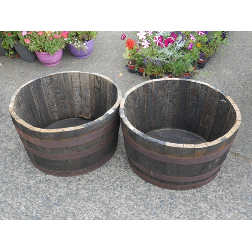 63 - 2 HALF BARREL PLANTERS