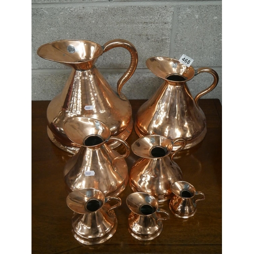 468 - SET OF 7 COPPER MEASURING JUGS