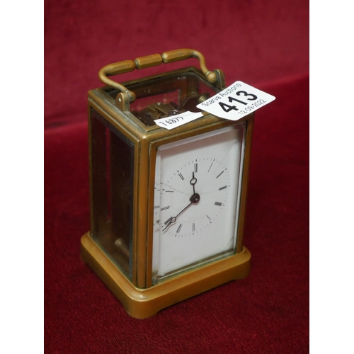 413 - SMALL BRASS & GLASS CARRIAGE CLOCK