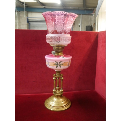 297 - OIL LAMP WITH RUBY SHADE