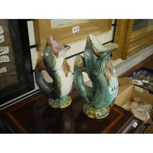 412 - 2 ANTIQUE FISH JUGS - SOME DAMAGE