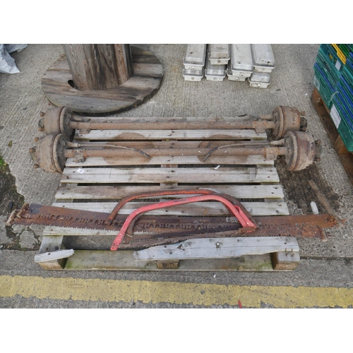 18 - PAIR OF TRAILER AXLES & OLD HAND SAWS