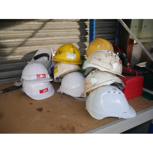 107 - LOT OF HARD HATS & PETROL CANS