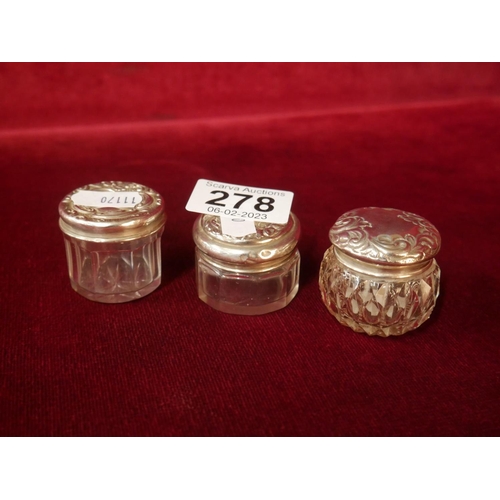 278 - 3 SILVER TOPPED GLASS JARS