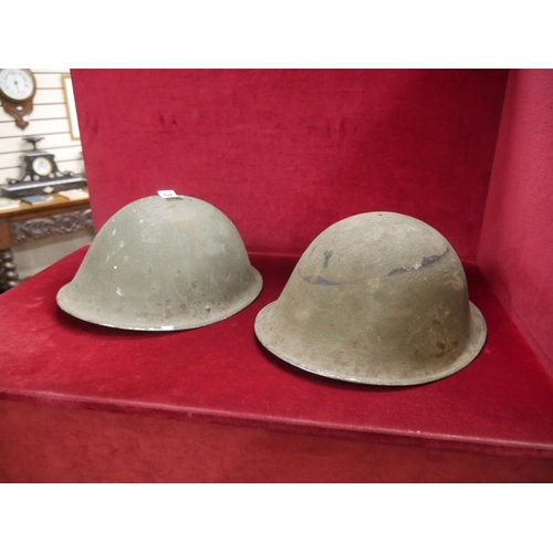 377 - 2 MILITARY HELMETS