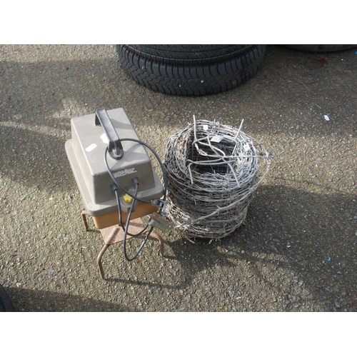 68 - PART ROLL OF BARBED WIRE & ELECTRIC FENCER UNIT - NOT CHECKED