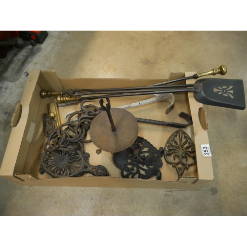 253 - BOX OF TRIVETS & FIRE IRONS ETC