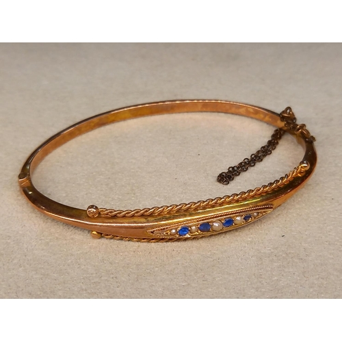 309 - 9CT GOLD BANGLE SET WITH BLUE STONES