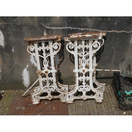 181 - 4 CAST IRON TABLE ENDS