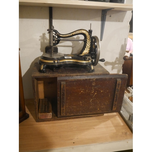 60 - CASED HAND OPERATED JONES SEWING MACHINE