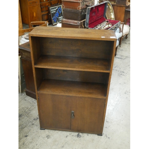 679 - ART DECO OAK BOOKCASE OVER 2 DOOR CUPBOARD