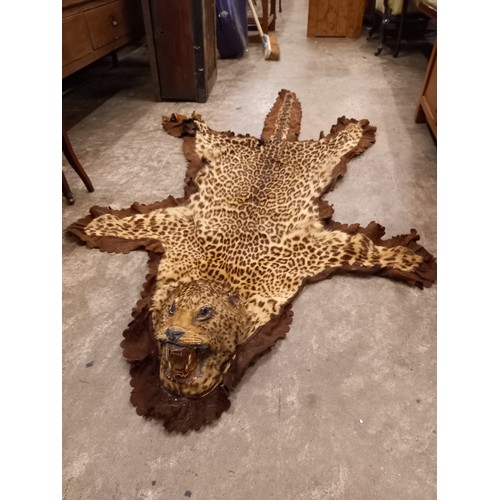 700 - LEOPARD SKIN WITH HEAD & 3 OTHER HIDE RUGS