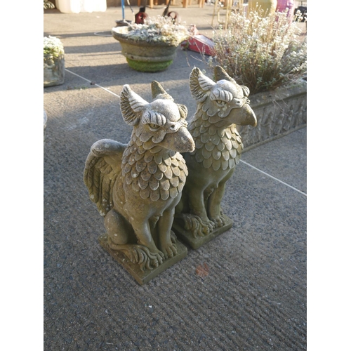 59 - PAIR OF RECONSTITUTED STONE GRIFFINS