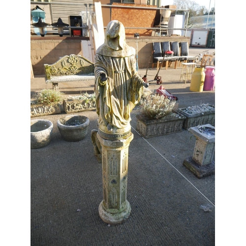 60 - RECONSTITUTED STONE FIGURE ON PLINTH WITH BRONZE HANDS