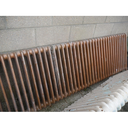 10 - CAST IRON RADIATOR APPROX 7ft LONG