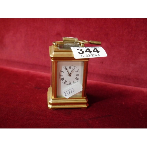 344 - MINIATURE BRASS & GLASS CARRIAGE CLOCK