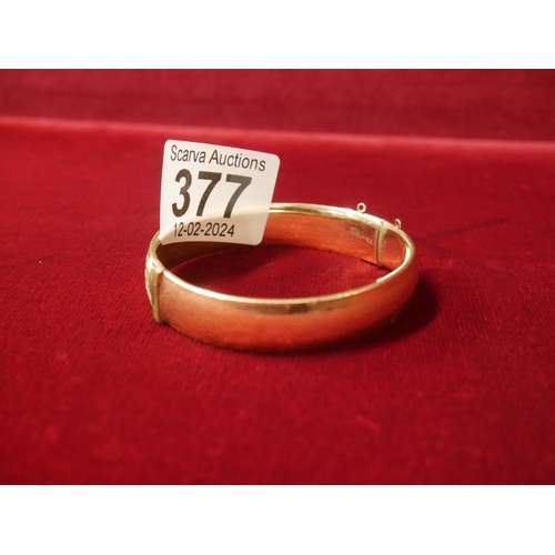 377 - 9CT ON METAL CORE BANGLE - 20% GOLD CONTENT