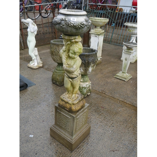 89 - RECONSTITUTED STONE PLANTER ON FIGURINE & PLINTH