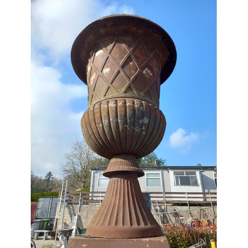 144 - LARGE ANTIQUE CAST IRON URN ON BASE WITH LION MASK DETAIL - APPROX  14 FT TALL - SMALL PIECE DAMAGED... 