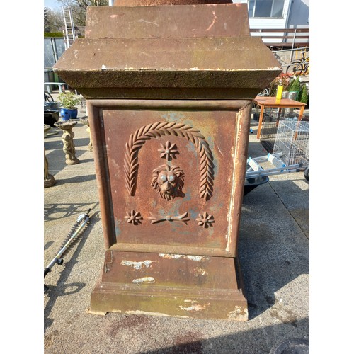 144 - LARGE ANTIQUE CAST IRON URN ON BASE WITH LION MASK DETAIL - APPROX  14 FT TALL - SMALL PIECE DAMAGED... 