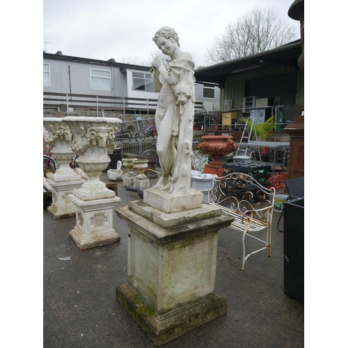 184 - AGED GARDEN FIGURINE ON PLINTH