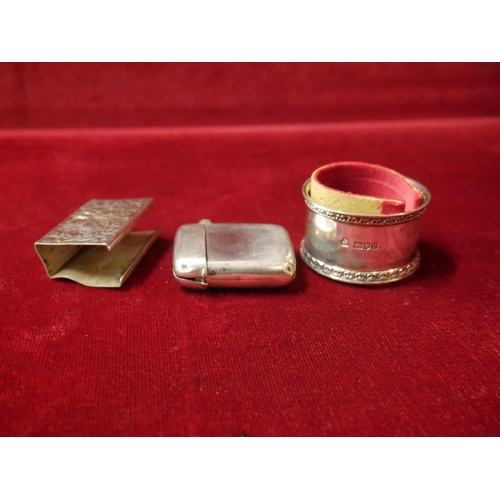 480 - SILVER NAPKIN RING, SILVER VESTA CASE WITH SOME DAMAGE & WHITE METAL MATCHBOX HOLDER