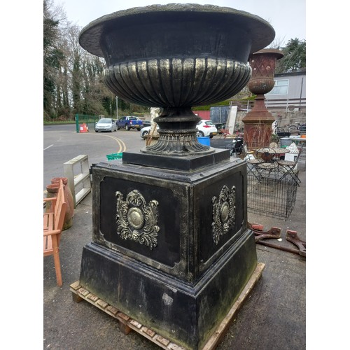 94 - PAIR OF LARGE CONCRETE PLANTERS ON CAST IRON BASES - BASE IS 4 ft x 4 ft - HEIGHT APPROX 8.1/2 ft