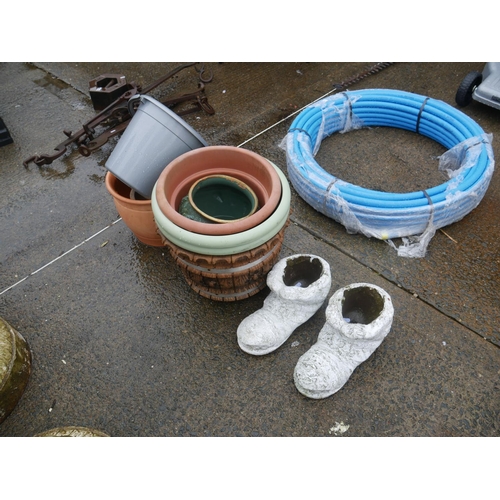 107 - PAIR OF CONCRETE PLANTER BOOTS PLUS PLASTIC PLANTERS