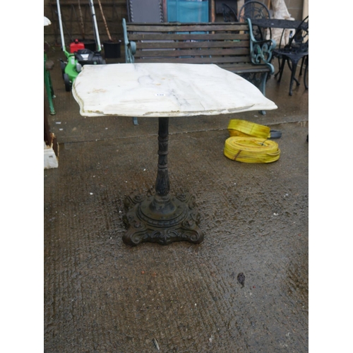 130 - CAST IRON TABLE WITH MARBLE TOP