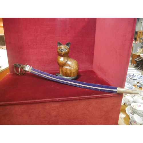 828 - SWORD & WOODEN CAT