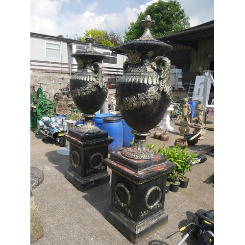 109 - PAIR OF LARGE CONCRETE URNS ON STANDS - APPROX 8 FT HIGH